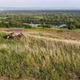 Aerial Shot of a Woman and a Horse Running Across the Field - VideoHive Item for Sale