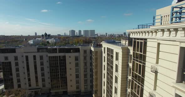 Autumn City Scene with Residential Complex By River and Church. Moscow, Russia