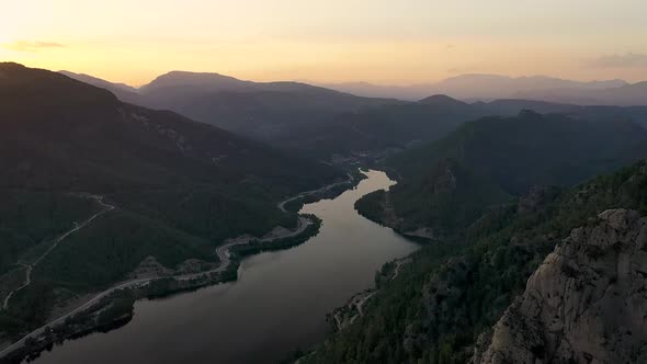 Sunset Over the River in the Mountains Filmed on a Drone
