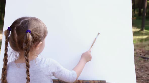 Happy Family Young Girl Drawing Coloring Picture with Brush Helping Cute Child Daughter Enjoying