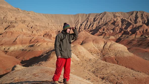 An Asianlooking Guy Walks and Looks at the Beauty of the Area