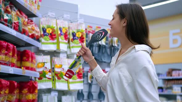 Funny Woman is Singing Jokingly in Supermarket