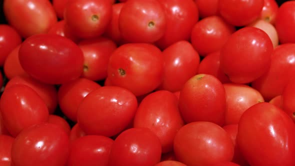 Close up Organic fresh red tomatos texture in basket on shelf in supermarket