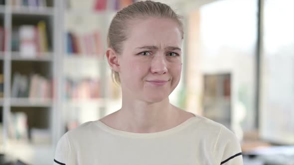 Portrait of Denying Young Woman Shaking Head No