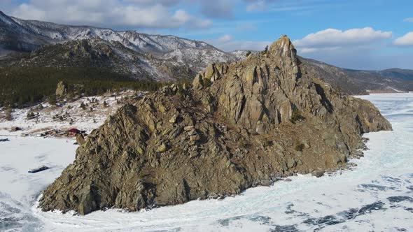 A cinematic winter landscape of Lake Baikal. A popular hiking route at the cliff