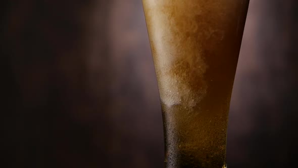 Beer Pouring in Glass in Bar