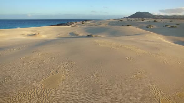 Aerial view of cars on the road of Corralejo Dunes Natural Park in Fuerteventura