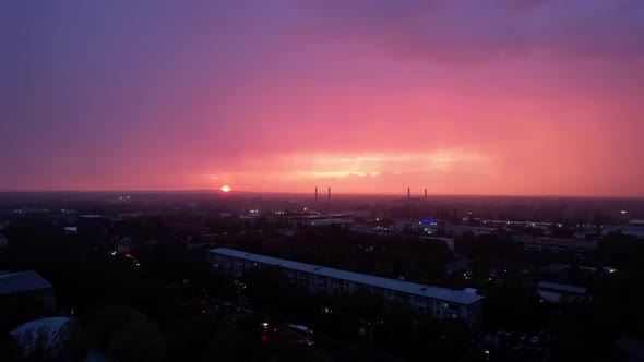 Epic Pink and Blue Sunset with Rain Over the City