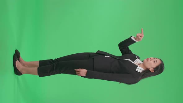 Full Side View Body Of An Angry Asian Business Woman Scolding While Standing On Green Screen