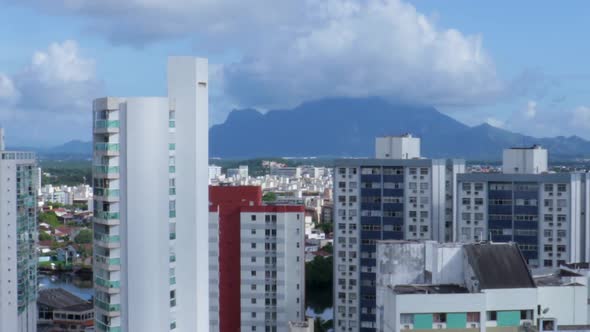 Time lapse over the skyline buildings with the Mestre Alvaro mountain on the back ground. On a sunny