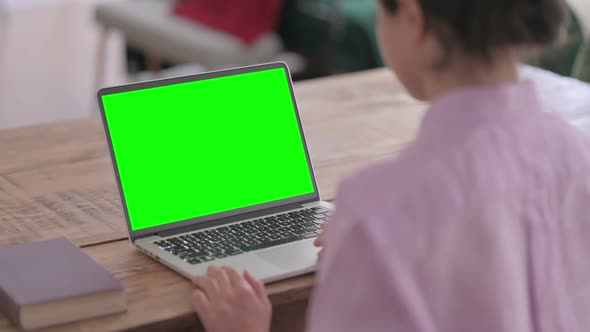 Indian Woman using Laptop with Green Screen