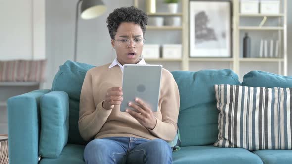 Upset African Girl Using Her Tablet