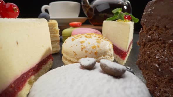 Variety of Cakes with Fruits. Cheese Cake, Chocolate Cake and Cream Puff Cake. Strawberry and Mint