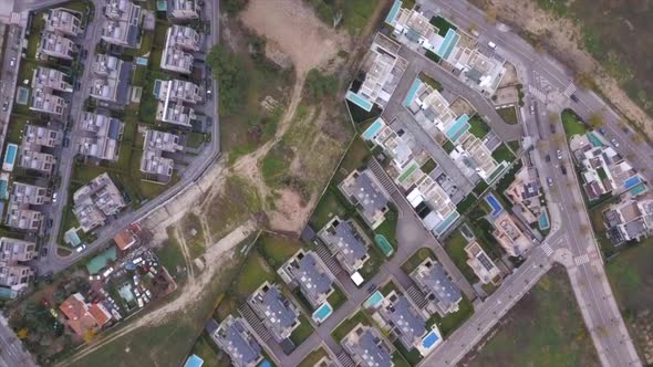 Drone descent into for sale plot of land surrounded by premium chalets