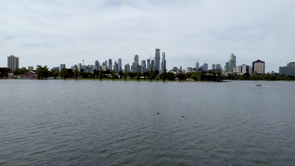 Establishing drone shot of Melbourne, Victoria, Australia. Flying over Albert Park Lake towards the