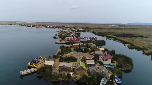 Slow drone movement. Uros Floating Islands over Titicaca lake, Peru