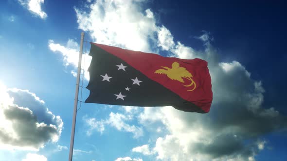 Flag of Papua New Guinea Waving at Wind Against Beautiful Blue Sky