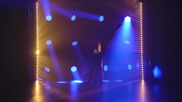 Trendy Young Woman Dancing Single in Club, Neon Light, Lots of Smoke. Fashion Street Wear