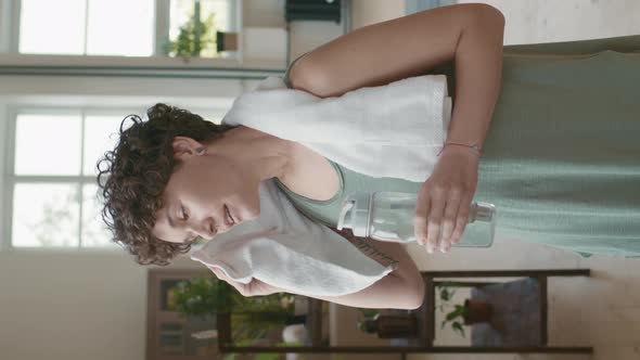 Vertical Portrait of Woman Resting after Yoga Practice