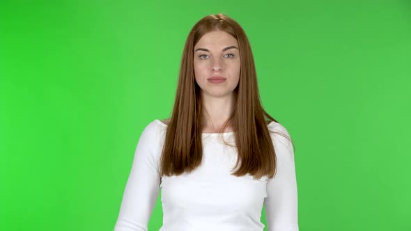 Portrait of Pretty Young Girl Is Sneezes and Covers Itself with an Elbow