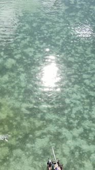 Boat Boats in the Ocean Near the Coast of Zanzibar Tanzania Slow Motion Vertical Video