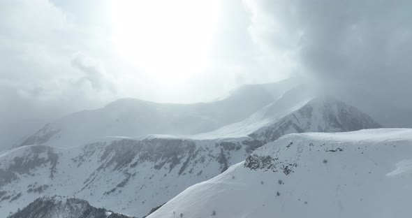 Aerial view of beautiful snowy mountains in Gudauri, Georgia