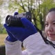 Close up Asian woman taking a photo of view at park in Autumn - VideoHive Item for Sale