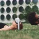 A girl lying on the grass and a guy who is going to lying down close to her - VideoHive Item for Sale