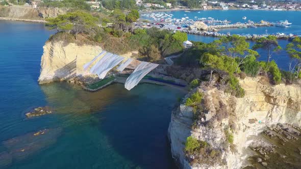 Aerial drone view video of famous islet of Cameo in Agios Sostis area of Laganas, Zakynthos island,