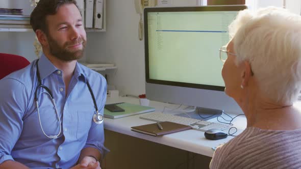 Doctor examining a senior woman in a retirement home