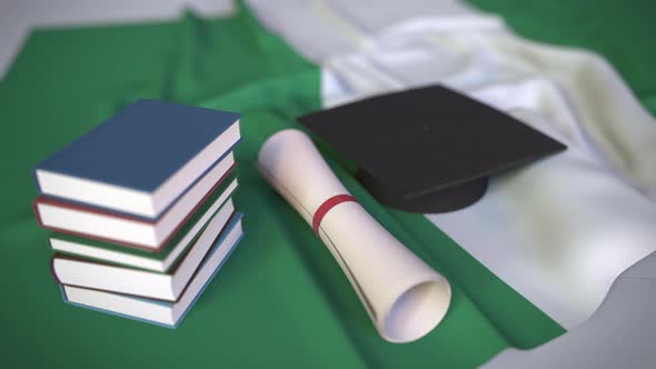 Graduation Cap and Diploma on the Flag of Nigeria alt