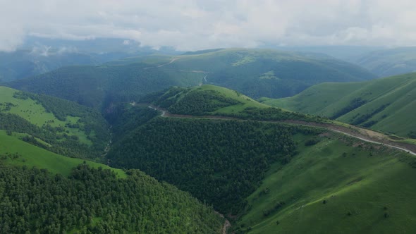 View of the Green Caucasus Mountains in Summer From the Sky