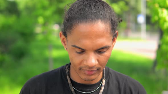 Young Man Mixed Race Looking at the Camera Laughing