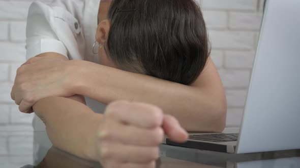 Sleepy woman in the office.