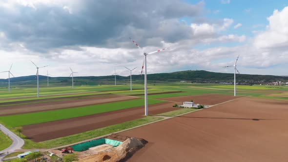 Aerial View of Wind Turbines Farm in Field. Austria. Drone View on Energy Production