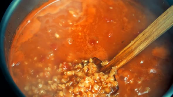 Chef Cooking And Stirring Red Tomato Vegetables Soup With Spices.Homemade Turkish Recipe Food In Pot