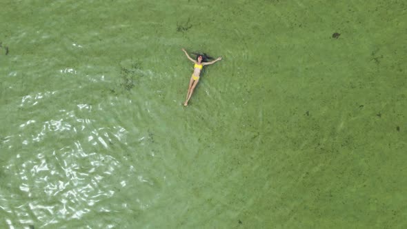 Aerial View Woman in Bikini Swimming in Calm Sea