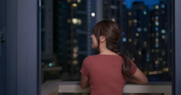 Woman Look Around the City Building at Night