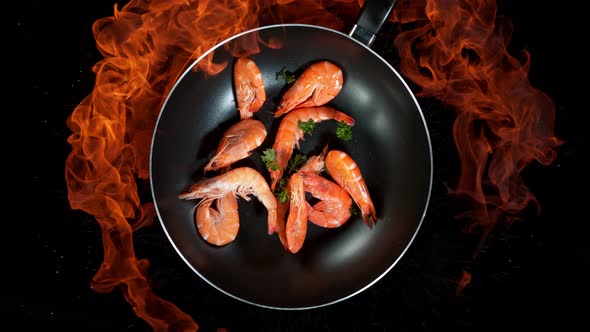 Super Slow Motion Shot of Throwing Prawns on Frying Pan and Fire Blast at 1000Fps