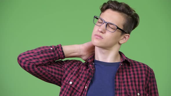 Young Handsome Teenage Nerd Boy Having Neck Pain