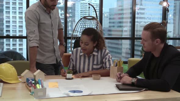 Creative Business People Group Having Conversation at Office Desk in Workplace