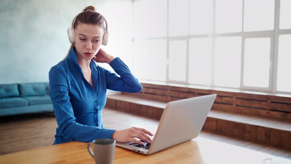 Happy Successful Businesswoman Wearing Headset with Microphone, Holding Video Call Conversation 