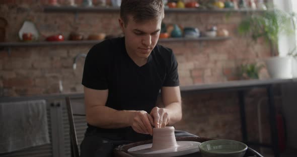 Potter Sculpts a Jug on a Potter's Wheel Video From Pottery Workshop Potter Makes Ceramics in Slow