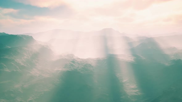 Aerial Vulcanic Desert Landscape with Rays of Light