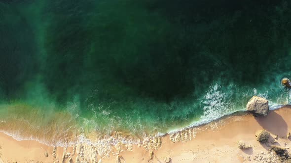 Beautiful Transparent Ocean Water Rolls on Sand Beach