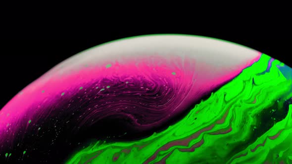 Macro Shot of a Soap Bubble Creates a Colorful and Black Background
