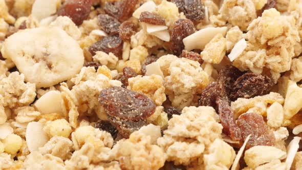 Tasty and crunchy muesli mixed of corn flakes and dried fruit slow tilt 4K 2160p 30fps UltraHD video