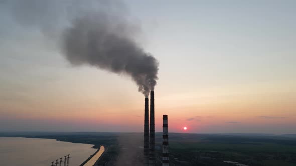 Aerial View of Coal Power Plant High Pipes with Black Smoke Moving Upwards Polluting Atmosphere at