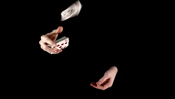 Trick of Magician with Card, Throwing Cards Up on Black, Slow Motion