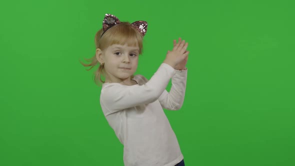 Girl in Headband with a Cat Ears Dancing. Happy Four Years Old Child. Chroma